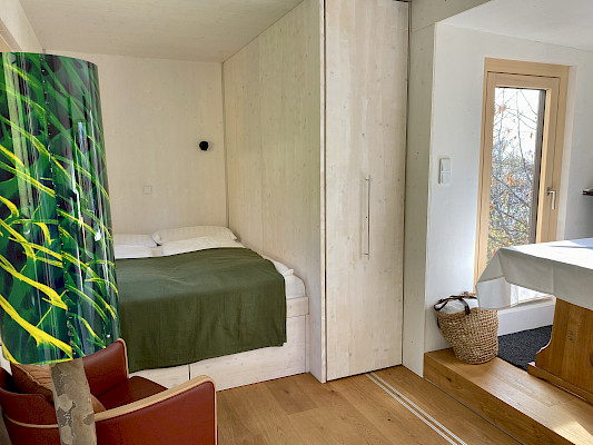 Tiny House Biohotel Grafenast Bett